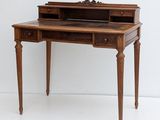 an old wooden desk with a drawer on top of it