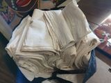 a pile of folded towels sitting on top of a table