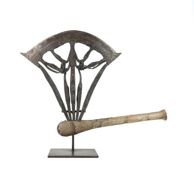 sculpture of a baseball bat and a shield on a stand