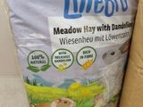 a bag of wheat next to a bag of rice