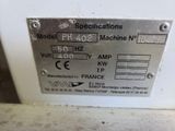 a close up of a metal plate on a machine
