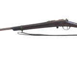 an old rifle with a wooden barrel on a white background