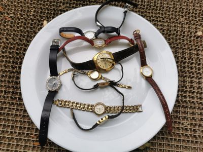 a white plate with a bunch of watches on it