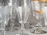a lot of wine glasses sitting on a table