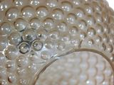 a close up of a glass vase with bubbles on it