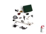 a green box that has a bunch of different items in it