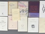a lot of books that are sitting on a table