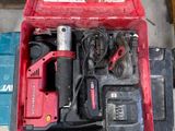 a red box with tools in it on the floor