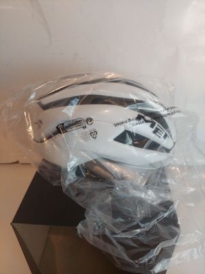 a helmet that is wrapped in plastic on a table