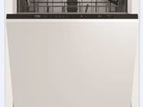 a white dishwasher sitting on top of a white counter