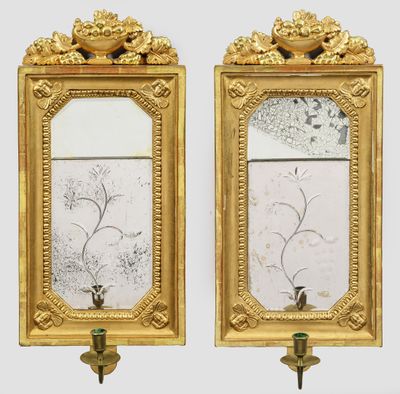 pair of gold framed mirrors with flowers and birds on them