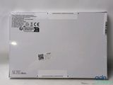 a close up of the back of a laptop with a sticker on it