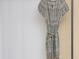 an image of a dress hanging on a clothes rack