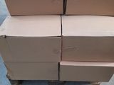 several cardboard boxes stacked on top of each other in a warehouse
