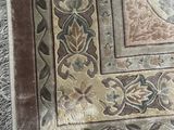 a rug with a picture on it on a wooden floor