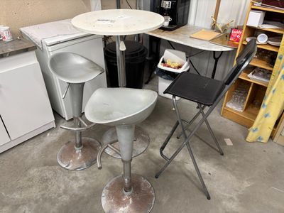 a small table and two chairs in a room