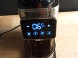 a blender that has a digital clock on the side of it