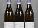 three bottles of wine sitting on top of a table next to each other