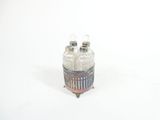 two salt and pepper shakers sitting on top of each other