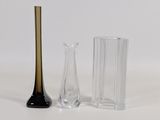 two vases and a glass vase on the table