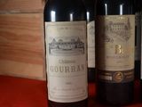 three bottles of wine sitting next to each other on a table
