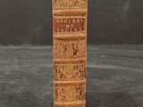 an old book that is sitting on a table