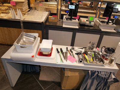a counter that has a lot of utensils on it