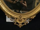 a woman taking a picture of herself in a mirror