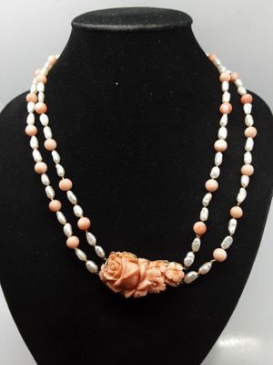 a close up of a necklace on a mannequin mannequin
