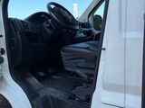 a white van with the door open and the driver ' s seat down