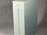 the book is sitting on the table in front of a gray background