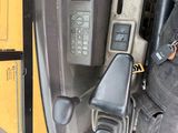 a close up of a car ' s dashboard and steering wheel