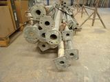 a pile of metal pipes sitting on the floor