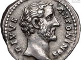 a silver coin with a head of a man with a beard
