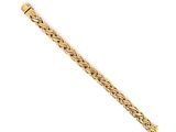 a gold bracelet with a braid design on a white background
