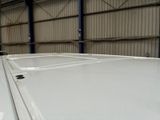 an image of a white car parked in a garage