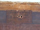 a plaque on the side of a wooden box