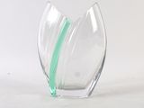 a glass vase with a green stripe inside of it