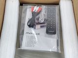 a cardboard box with a remote control and other items in it