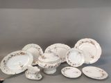 many plates and bowls that are sitting on a table