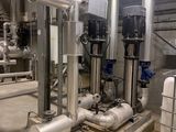 pipes and valves in a room with a lot of pipes