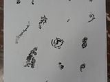 a piece of paper with drawings on it on a table