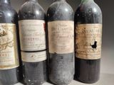three bottles of red wine are lined up on a table