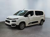 the white van is parked in a large room
