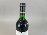 a bottle of wine that is sitting on a table