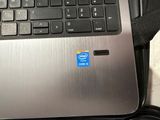 a close up of a laptop with a blue sticker on it