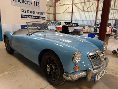 an image of a blue sports car parked in a garage