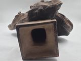 a small metal object that is sitting on a table