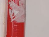 a red fire hydrant with a white cross painted on it