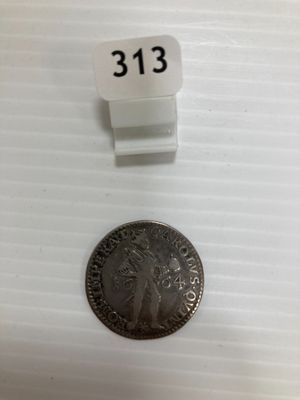 une petite pièce sur laquelle figure un petit chiffre